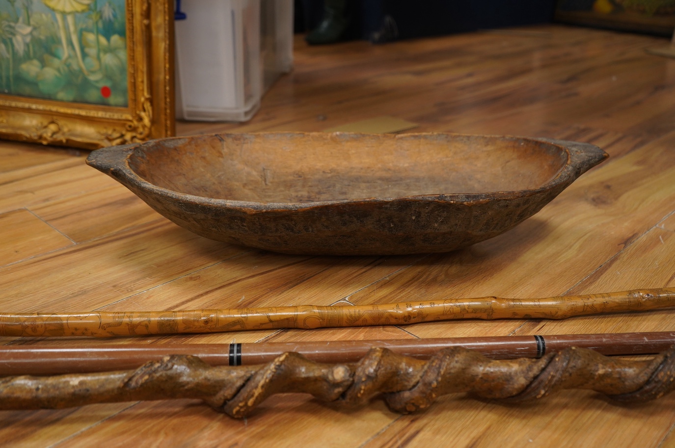 Three novelty walking sticks and gouged gathering bowl. Condition - fair